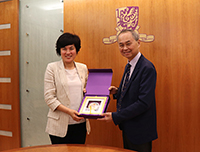 Professor Fok Tai-fai (right), Acting Vice-Chancellor of CUHK presents a souvenir to Professor Liu Yahong, President of SCAU